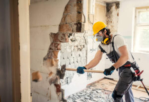 Man Demolishing Wall in Manitoba, Canada 